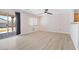 Cozy living area featuring new flooring, a sliding glass door to the backyard, and neutral tones at 9013 Meisenheimer Ave, Las Vegas, NV 89143