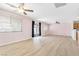 Open-concept living area with modern flooring, adjacent to kitchen at 9013 Meisenheimer Ave, Las Vegas, NV 89143