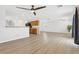 Open-concept living area with ceiling fans, wood cabinets, and bright interiors at 9013 Meisenheimer Ave, Las Vegas, NV 89143