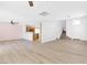 Bright living area with seamless flow to the kitchen, featuring modern flooring and an open staircase at 9013 Meisenheimer Ave, Las Vegas, NV 89143