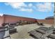 Private backyard features an outdoor kitchen, lounge seating, and space for entertaining at 9045 Knots Estate St, Las Vegas, NV 89139
