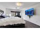 Bedroom with plush bedding, large window, cityscape art, and dresser at 9045 Knots Estate St, Las Vegas, NV 89139