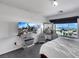 Bedroom with a plush bed, decorative mirror and skyline view outside the large window at 9045 Knots Estate St, Las Vegas, NV 89139