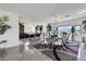 An elegant dining area with modern decor, marble floors, recessed lighting, and a large window with neighborhood views at 9045 Knots Estate St, Las Vegas, NV 89139