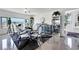 An elegant dining room with modern decor, marble floors, recessed lighting, and a large window with neighborhood views at 9045 Knots Estate St, Las Vegas, NV 89139