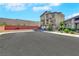 Contemporary home featuring a three-car garage, balcony, and well-maintained landscaping at 9045 Knots Estate St, Las Vegas, NV 89139