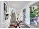 Inviting foyer showcases elegant decor, a stylish staircase, and sleek tile floors creating a welcoming ambiance at 9045 Knots Estate St, Las Vegas, NV 89139