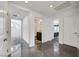 Hallway with tile floors leading to bathroom, stairway and bedroom at 9045 Knots Estate St, Las Vegas, NV 89139