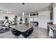Modern kitchen featuring a large island with seating, stainless steel appliances, and ample counter space at 9045 Knots Estate St, Las Vegas, NV 89139