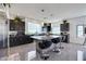 Bright kitchen featuring stainless appliances, granite countertops, and a large center island with bar stool seating at 9045 Knots Estate St, Las Vegas, NV 89139