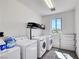 Bright laundry room featuring side-by-side washer and dryer at 9045 Knots Estate St, Las Vegas, NV 89139