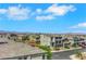 Desirable neighborhood showcasing well-maintained homes and manicured lawns, complete with picturesque mountain views in the distance at 9045 Knots Estate St, Las Vegas, NV 89139