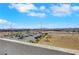 Scenic rooftop view overlooking distant mountains and a vibrant cityscape under a bright sky at 9045 Knots Estate St, Las Vegas, NV 89139