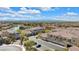 Residential community view showcases modern townhomes with attached garages, a pond, and mountain views at 985 Via Lombardi Ave, Henderson, NV 89011