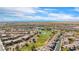 Aerial view of the community showcasing the golf course, ponds and lush green landscape at 985 Via Lombardi Ave, Henderson, NV 89011