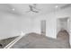 Bright bedroom featuring neutral carpeting, white walls, a ceiling fan and recessed lighting at 985 Via Lombardi Ave, Henderson, NV 89011