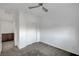 Neutral carpeted bedroom with closet and access to additional rooms at 985 Via Lombardi Ave, Henderson, NV 89011