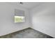 Minimalist bedroom with neutral carpet, window, and ample natural light at 985 Via Lombardi Ave, Henderson, NV 89011