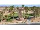 Community bell tower next to the golf course surrounded by palm trees at 985 Via Lombardi Ave, Henderson, NV 89011