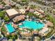 Resort-style community pool with palm trees, lounge chairs, and pristine landscaping at 985 Via Lombardi Ave, Henderson, NV 89011