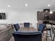 Cozy dining room with modern chairs and view of kitchen at 985 Via Lombardi Ave, Henderson, NV 89011