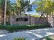 Attractive stone community entrance with lush landscaping and clear signage at 985 Via Lombardi Ave, Henderson, NV 89011