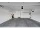 Spacious garage with overhead storage and room for multiple vehicles at 985 Via Lombardi Ave, Henderson, NV 89011