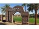 Entrance to the Chimera Golf Club with manicured landscaping and scenic mountain views at 985 Via Lombardi Ave, Henderson, NV 89011