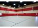 Spacious indoor gymnasium featuring basketball hoops, and bright lighting at 985 Via Lombardi Ave, Henderson, NV 89011