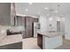 Well-equipped kitchen with granite countertops, stainless steel appliances, and a functional island at 985 Via Lombardi Ave, Henderson, NV 89011