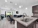 Modern kitchen with granite countertops and stainless steel sink at 985 Via Lombardi Ave, Henderson, NV 89011