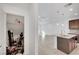 View of the kitchen featuring stainless steel appliances, an island, and tile floors at 985 Via Lombardi Ave, Henderson, NV 89011