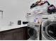 Well-equipped laundry room with modern washer and dryer at 985 Via Lombardi Ave, Henderson, NV 89011