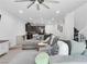 Inviting living room with comfortable seating, modern decor, and seamless flow to the kitchen at 985 Via Lombardi Ave, Henderson, NV 89011