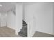 View of a staircase with carpeted steps and white railings leading to the upper level at 985 Via Lombardi Ave, Henderson, NV 89011