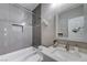 Modern bathroom features a shower-tub combination, tile accents, vanity and neutral paint at 9901 Trailwood Dr # 2109, Las Vegas, NV 89134
