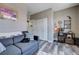 Cozy guest room is decorated with an ample storage closet and grey wood floors at 9901 Trailwood Dr # 2109, Las Vegas, NV 89134