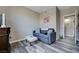 A comfortable guest bedroom features a couch and a contemporary wood floor at 9901 Trailwood Dr # 2109, Las Vegas, NV 89134