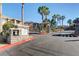 Gated community entrance with stone pillars, a map display, and well-maintained landscaping at 9901 Trailwood Dr # 2109, Las Vegas, NV 89134