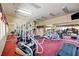 Well-equipped gym with modern exercise machines, mirrors, and plenty of room for activities at 9901 Trailwood Dr # 2109, Las Vegas, NV 89134