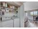 Efficient laundry closet with shelving located in the home at 9901 Trailwood Dr # 2109, Las Vegas, NV 89134