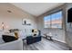 Bright and airy living room featuring a large window, stylish decor, and comfortable seating at 9901 Trailwood Dr # 2109, Las Vegas, NV 89134