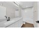 Bright bathroom featuring a single vanity, tub with shower, and modern fixtures at 10029 Cluny Ave, Las Vegas, NV 89178