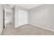 Bedroom featuring neutral walls, plush carpeting, and a spacious closet at 10029 Cluny Ave, Las Vegas, NV 89178