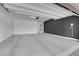 Spacious two-car garage with a pristine concrete floor, ample lighting, and clean white walls at 10029 Cluny Ave, Las Vegas, NV 89178