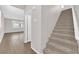 View of staircase leading up to second level with living area in background at 10029 Cluny Ave, Las Vegas, NV 89178