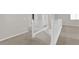 Hallway with carpeted floors and white railings leading to the stairway at 10029 Cluny Ave, Las Vegas, NV 89178