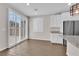 Modern kitchen with white cabinets, granite countertops, stainless steel appliances, and plantation shutters at 10029 Cluny Ave, Las Vegas, NV 89178
