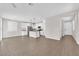Open-concept living area with hardwood floors, ample natural light, and view of the kitchen at 10029 Cluny Ave, Las Vegas, NV 89178