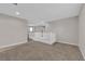 Open loft area with soft carpeting, white railing, and neutral wall color, perfect for flexible living space at 10029 Cluny Ave, Las Vegas, NV 89178